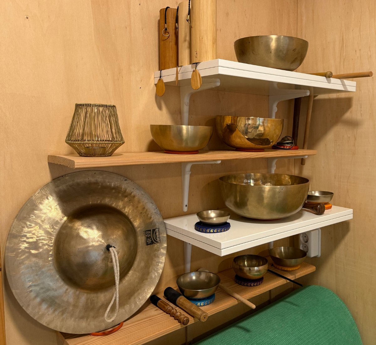 Elena Lisnic offering a sound massage with therapeutic singing bowls